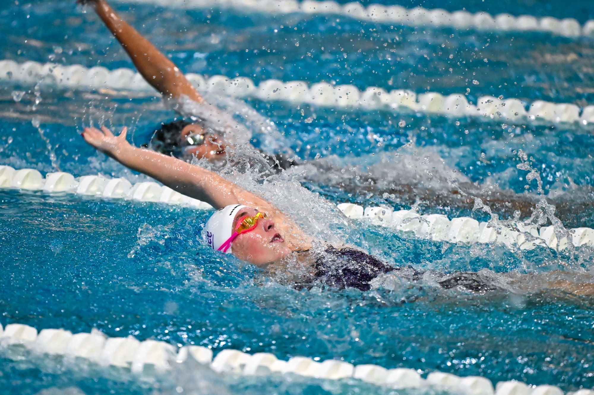 Sewanee women's swimmer performing the backstroke