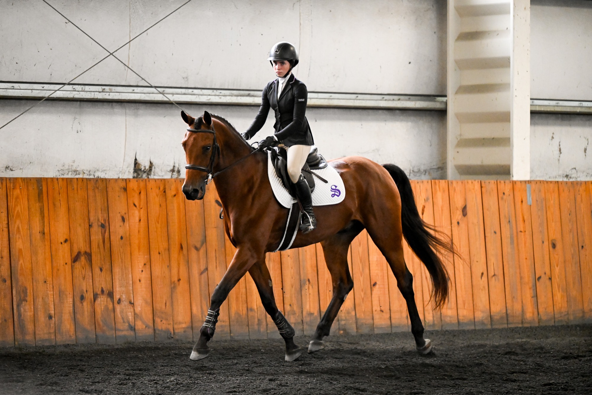 Josephine Foshee rides in indoor arena
