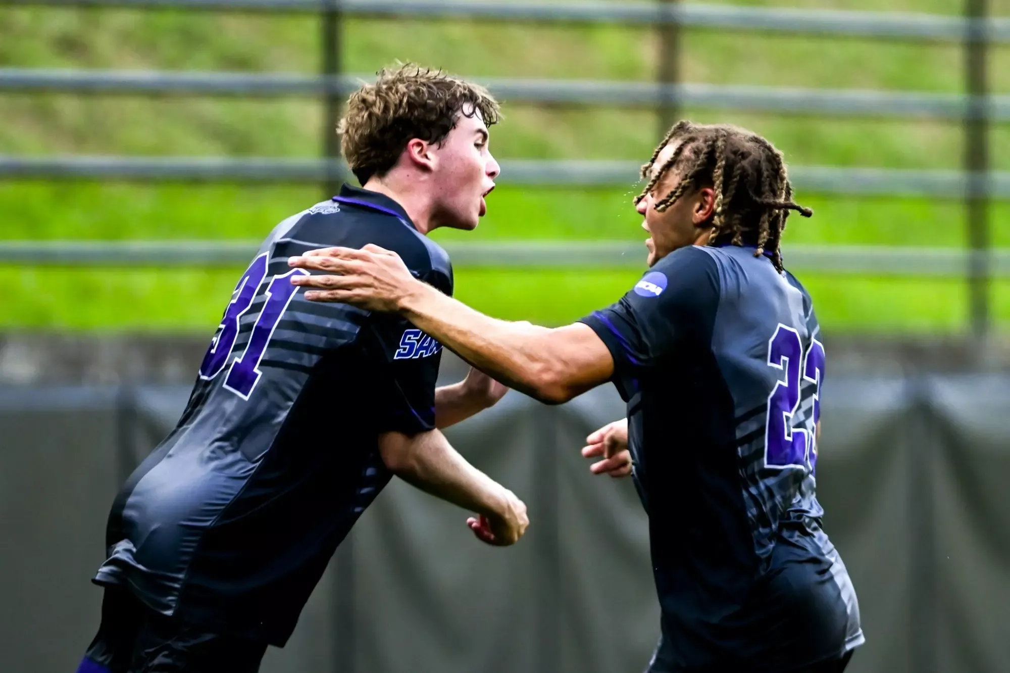 tommy, reed celebrating goals against Emory