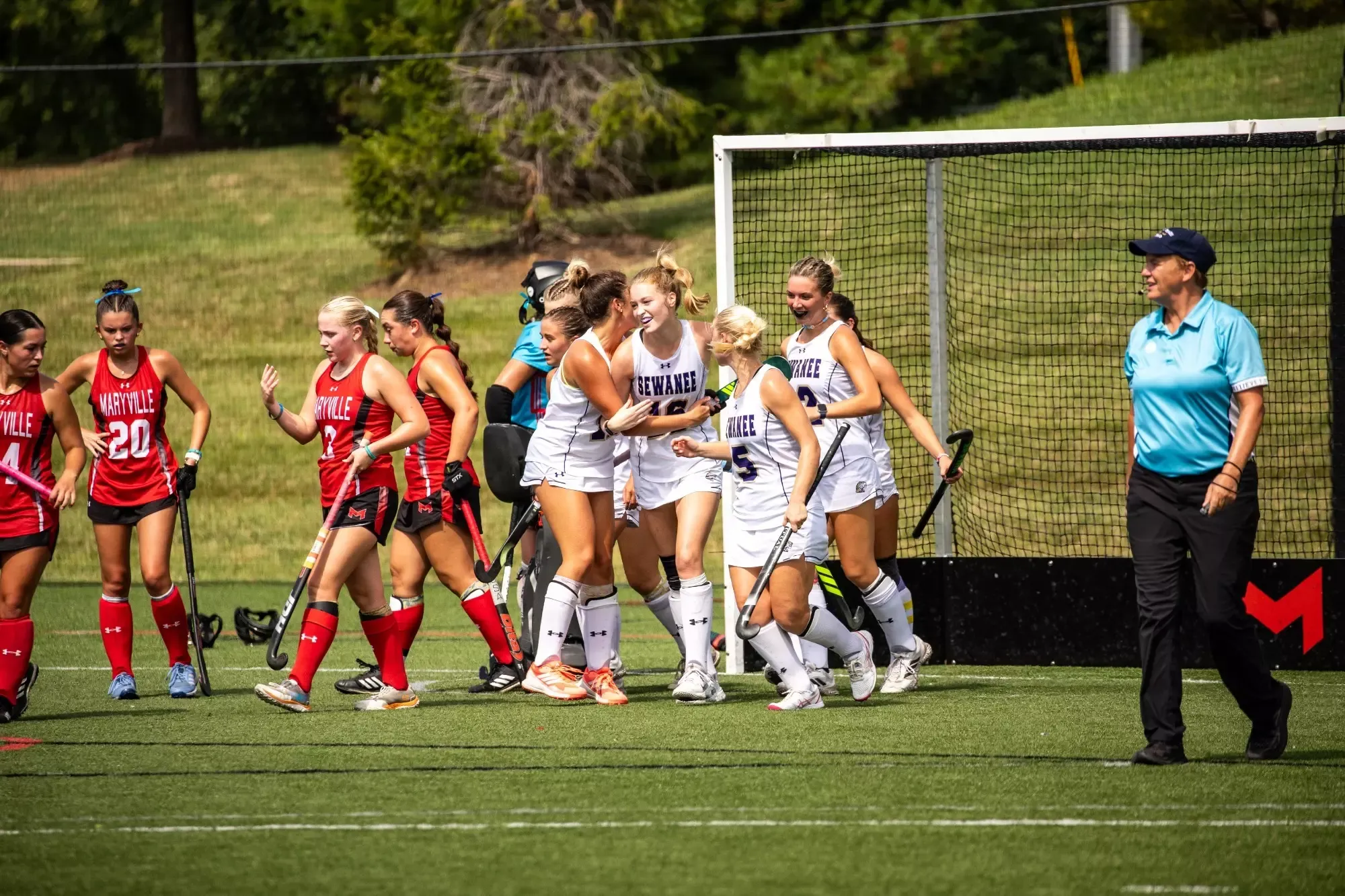 field hockey celebrates as cate crane scores against Maryville