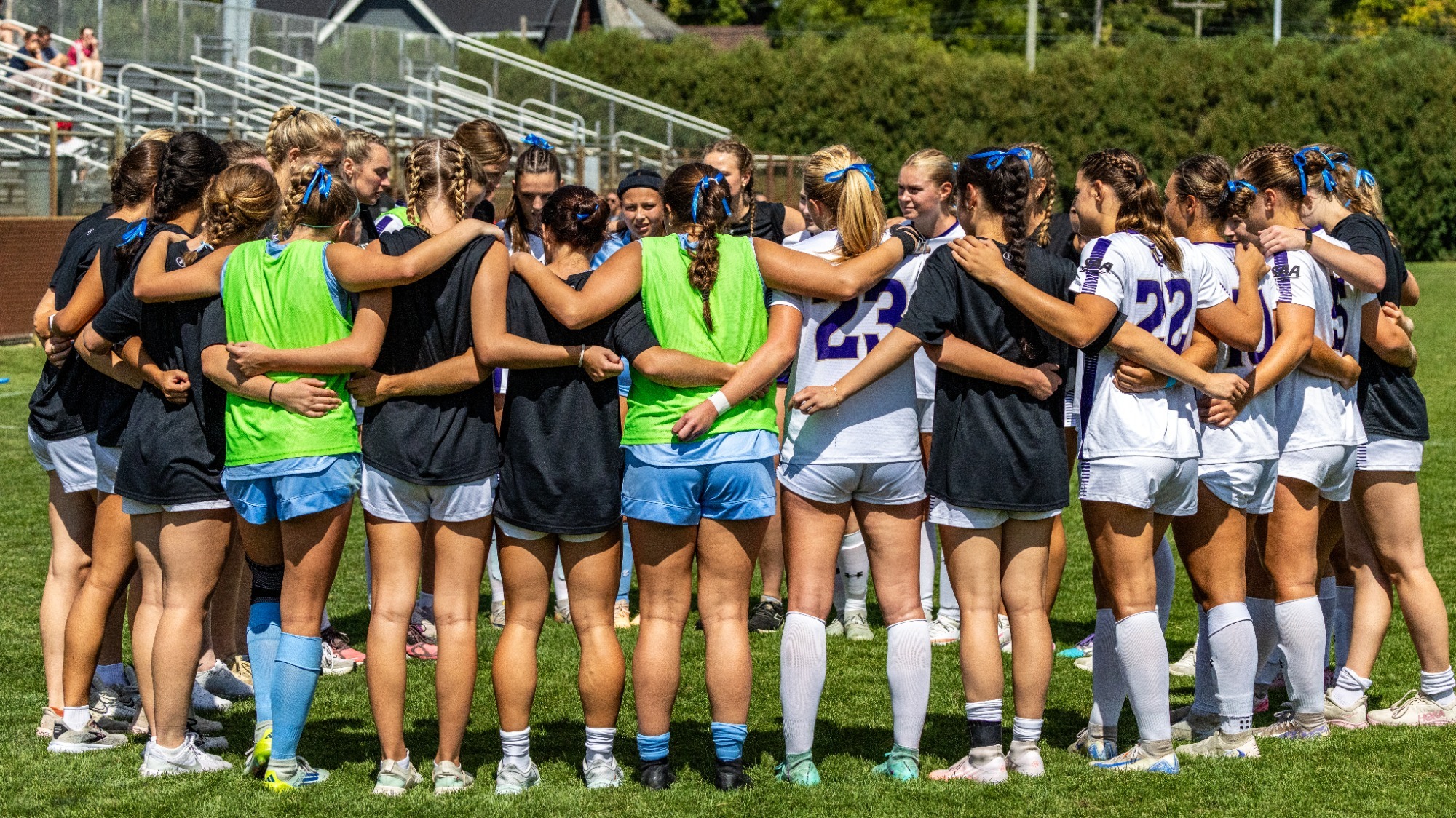 Sewanee women's soccer in a team huddle
