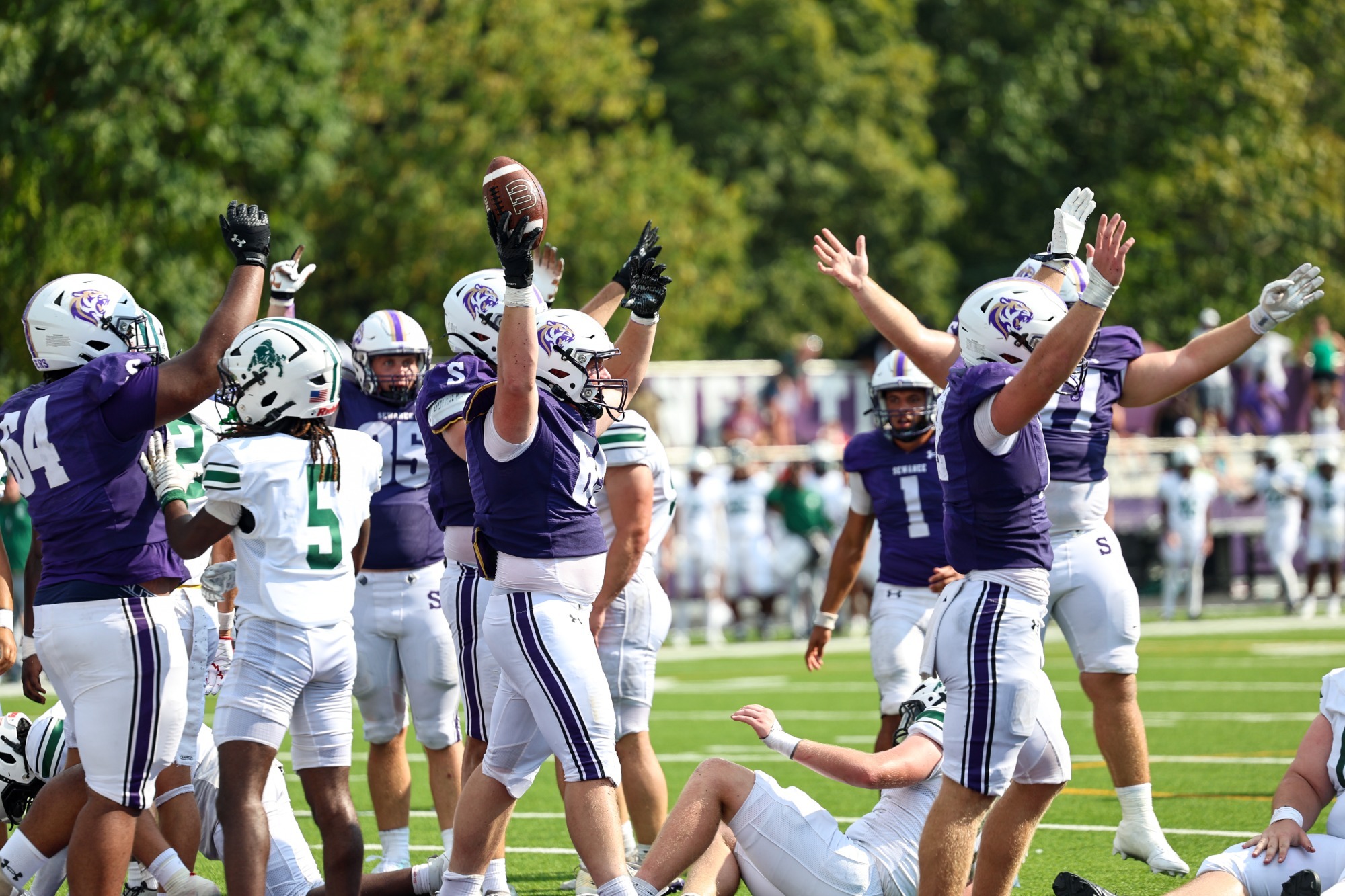 Offensive lineman Ean Cox, #65, celebrates after recovering a fumble for a touchdown