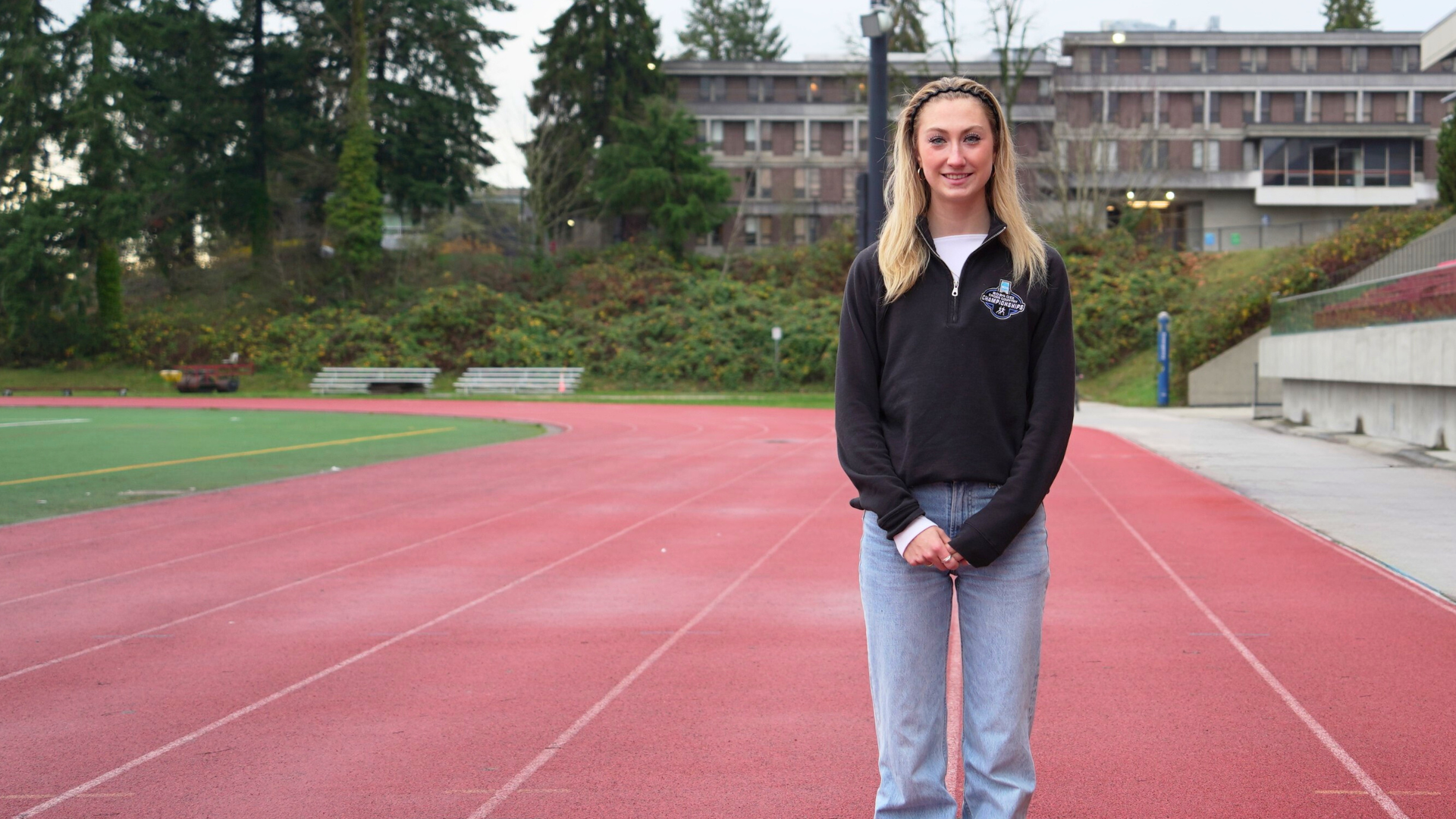 Rachael Watkins stands on the track at Terry Fox Field
