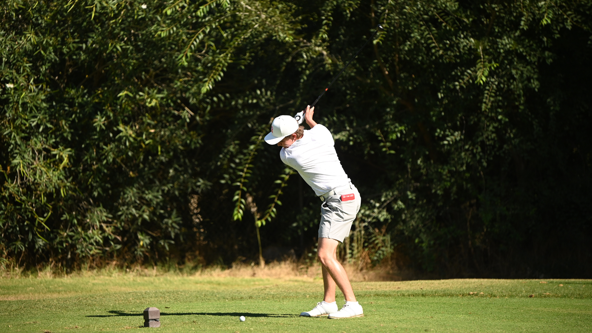 Golfer Justin Bjornson winds up to hit out off the tee