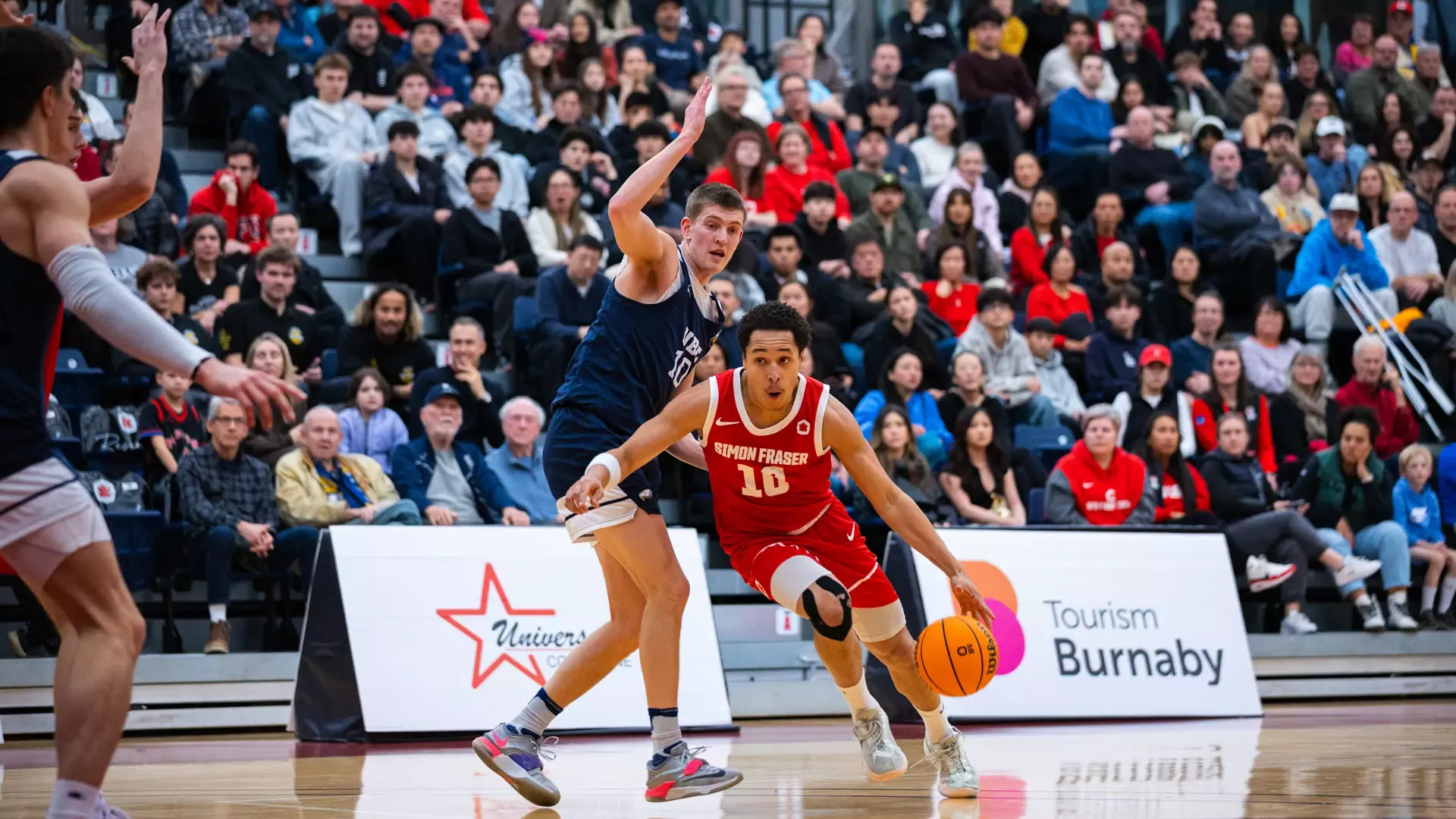 Daniel Augusto Smith driving with the ball in front of a sold-out West Gym Buchanan Cup crowd vs. British Columbia, Nov. 15, 2025