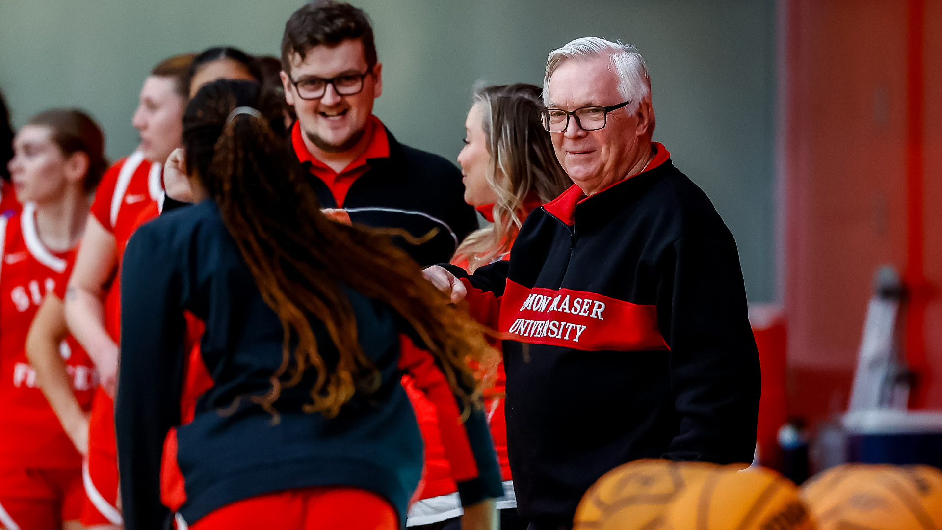 Bruce Langford (left) before the Red Leafs' game vs. Point Loma Nazarene (Calif.) on Nov. 30, 2024.