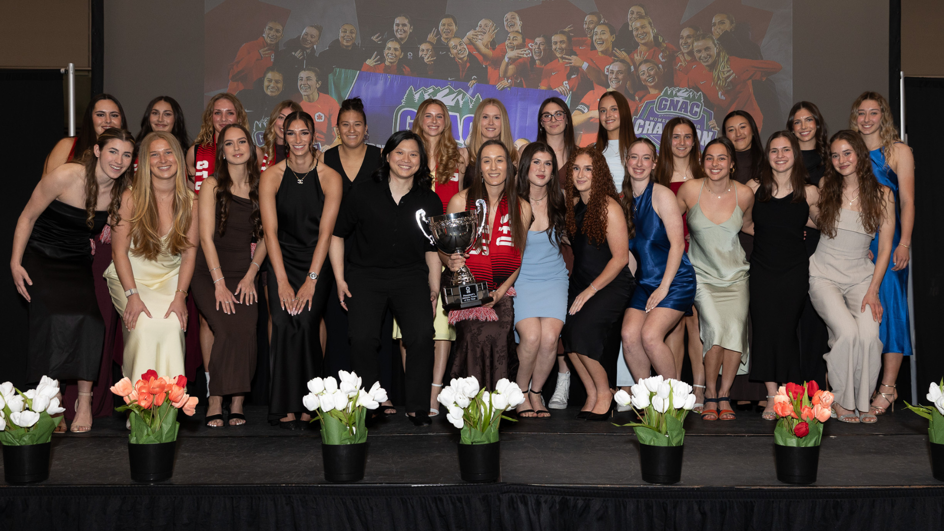 The Women's Soccer team gathers on stage to accept the President's Team of the Year award at the 2026 Athletic Awards 