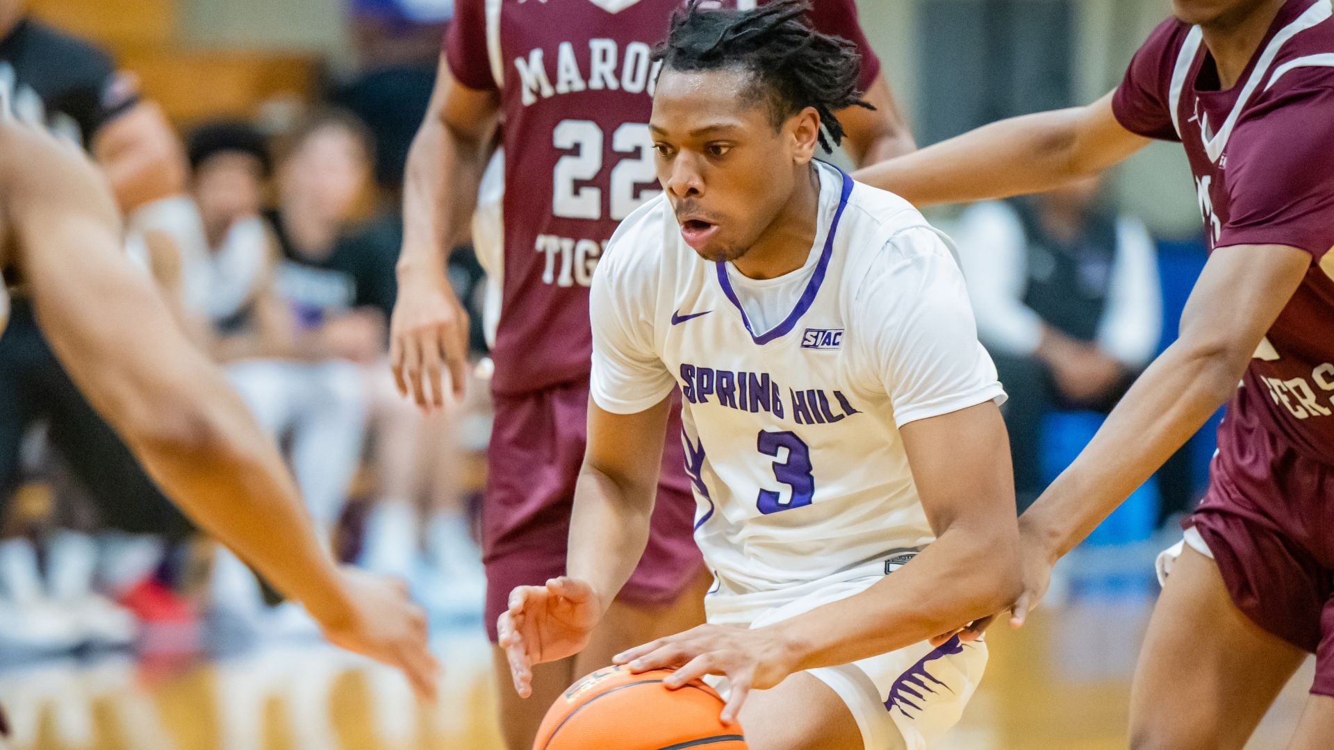 Amaan Sanni weaves through traffic