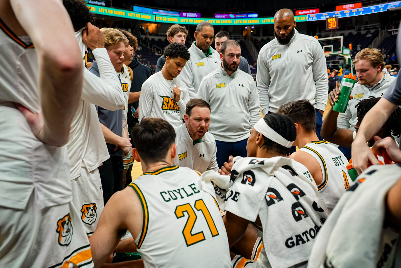 Coach McNamara team huddle