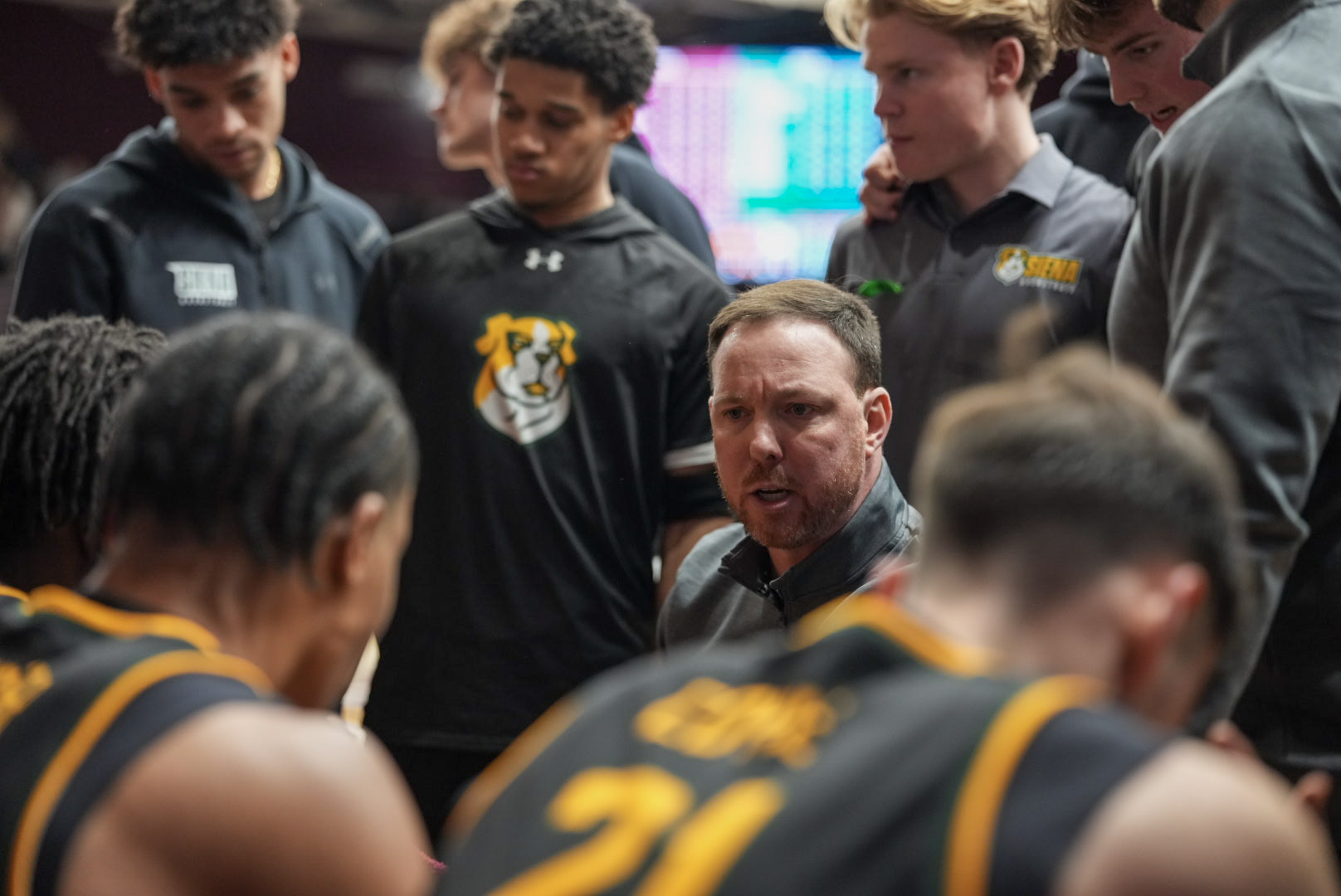 Coach McNamara team huddle