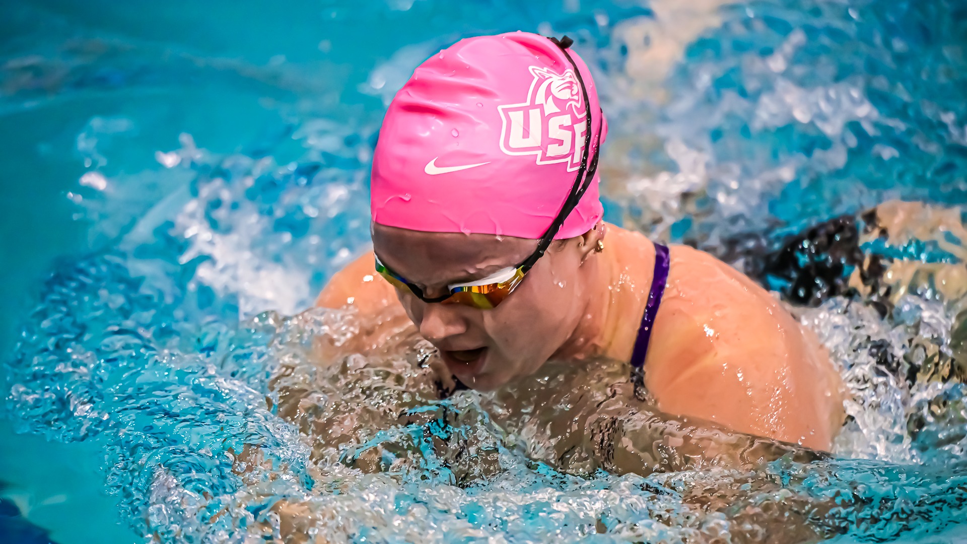 Kylie Cottrell swimming at UMary
