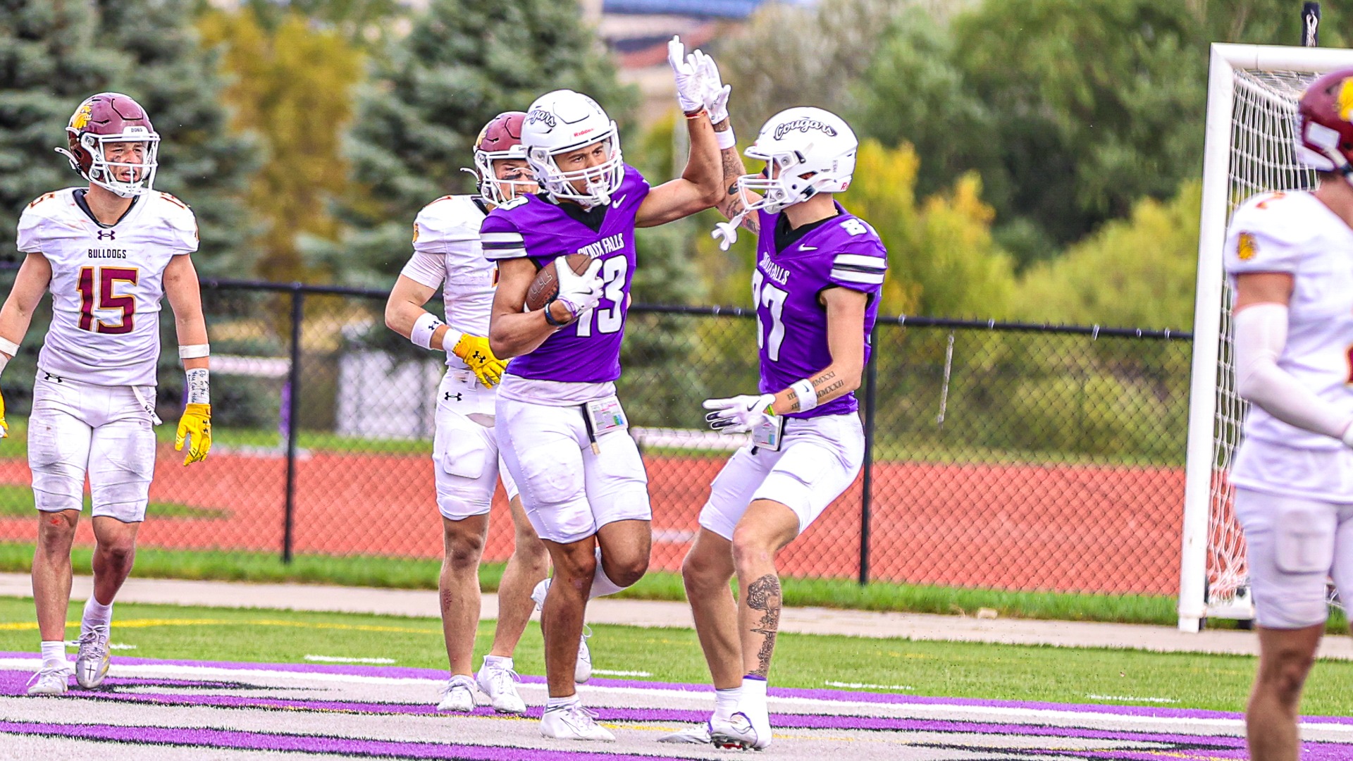 Isaiah Emanuel and Christian Janis celebrate after a touchdown against Minnesota Duluth