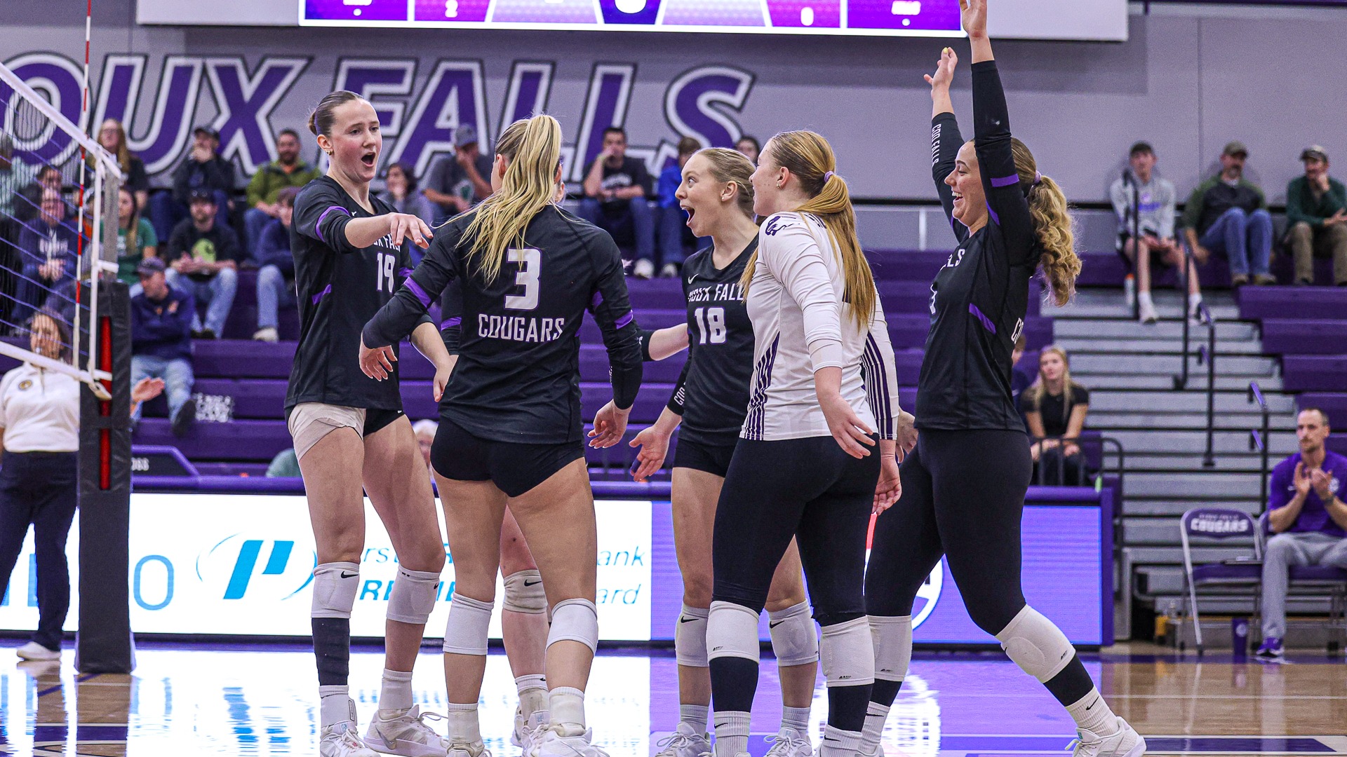 Ella Walker and team cheering following a point against Mary