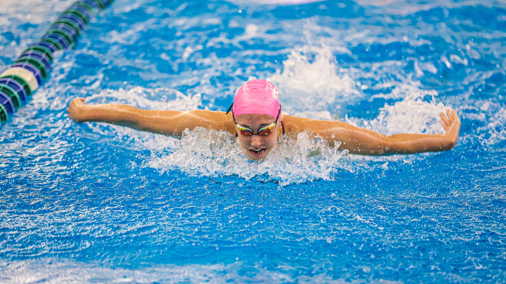 Irene Paris swimming the butterfly against MSU Moorhead