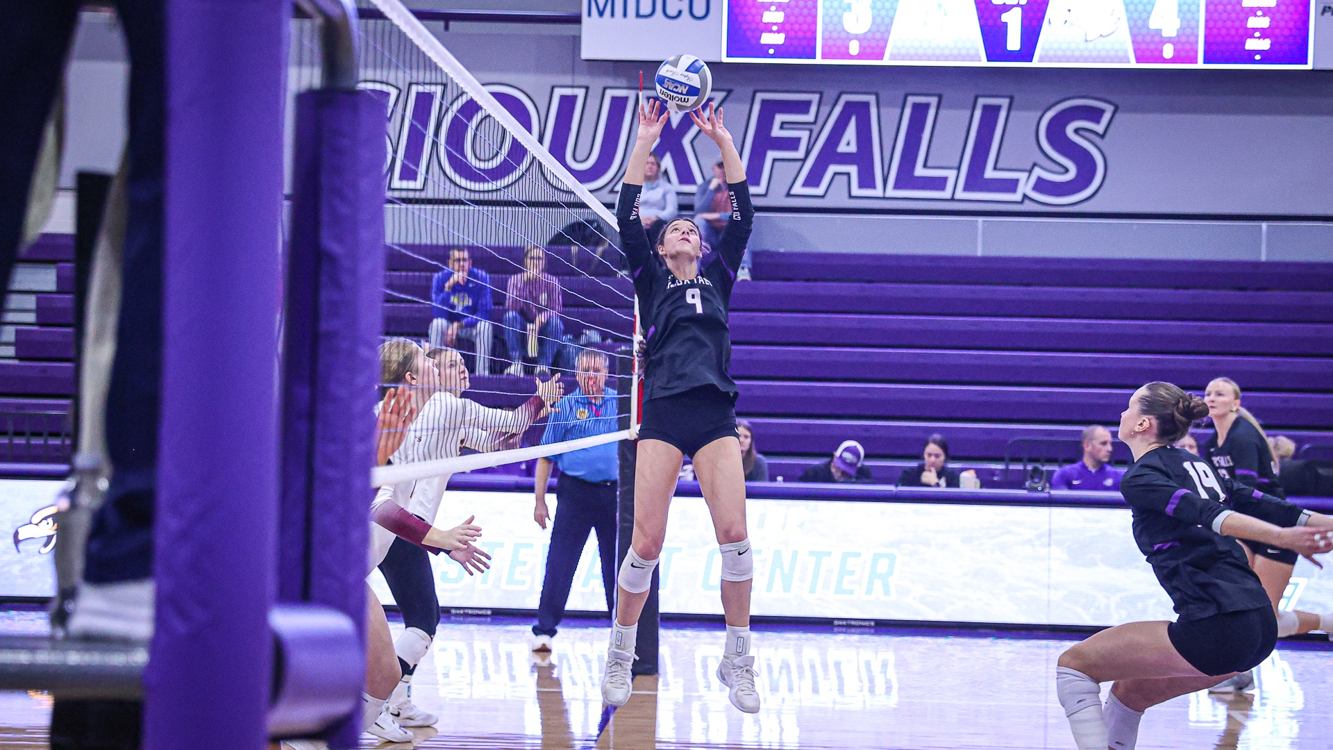 Hollie Peterson setting against Minnesota Crookston
