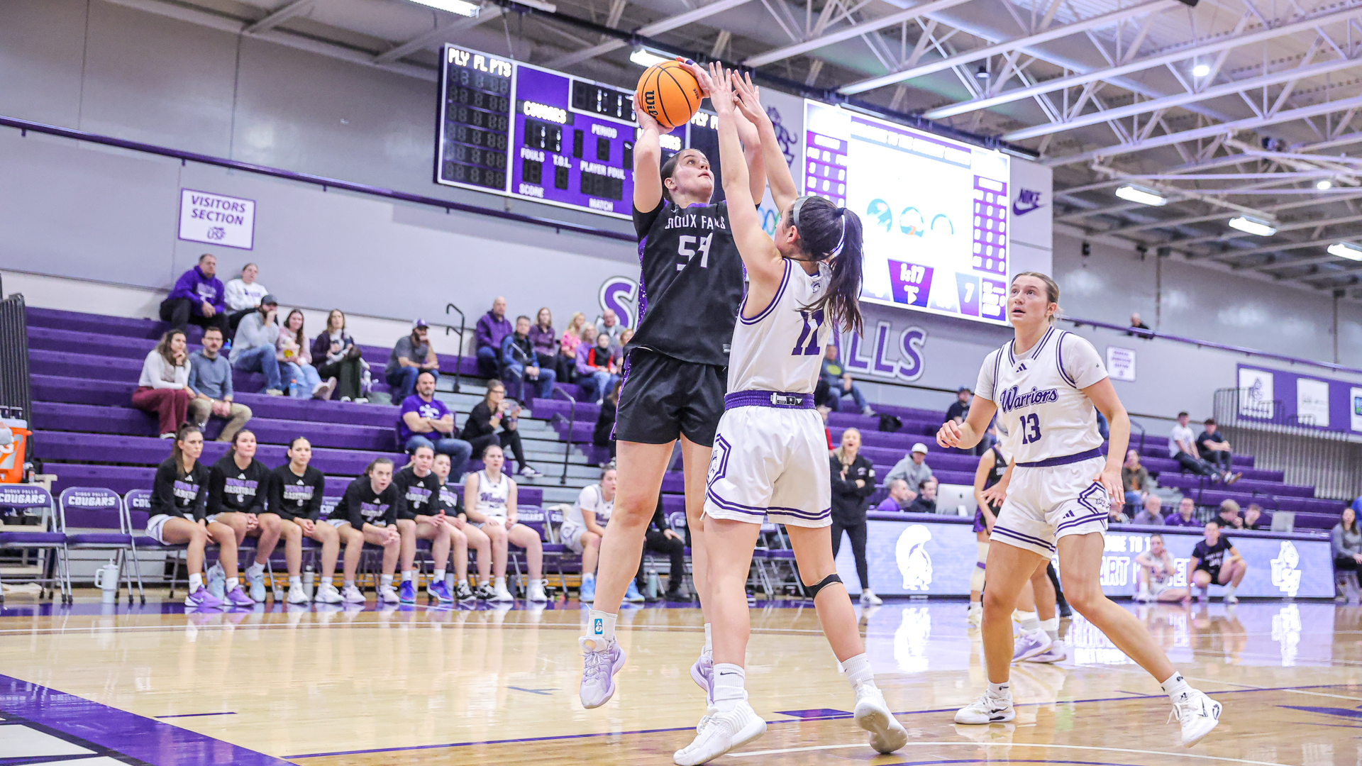 Krista Langager takes a shot over a defender