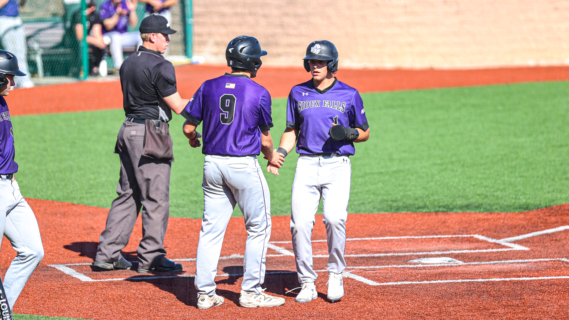 Cullen Verville and Casey Sehr celebrate at home plate
