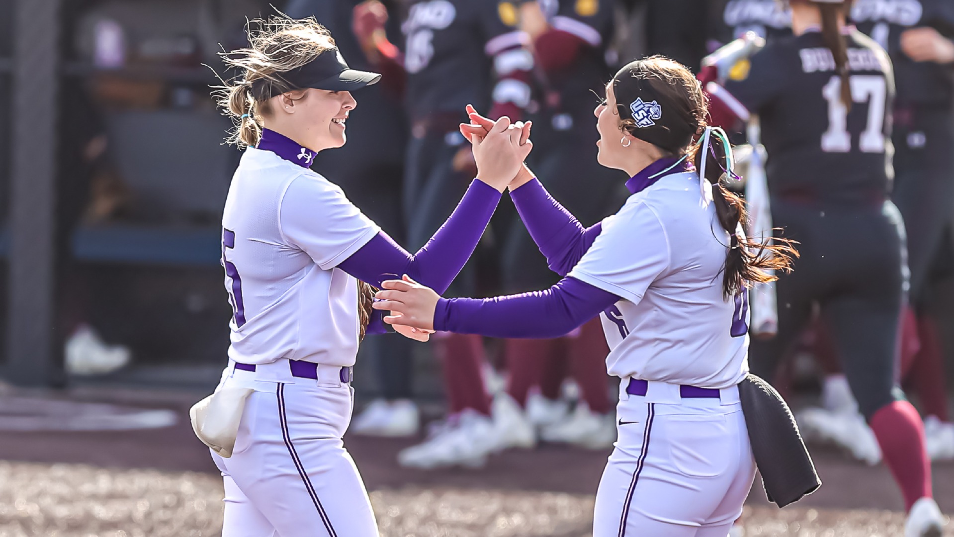 Maddi Duncan and Lauryn Foudree high-five post game