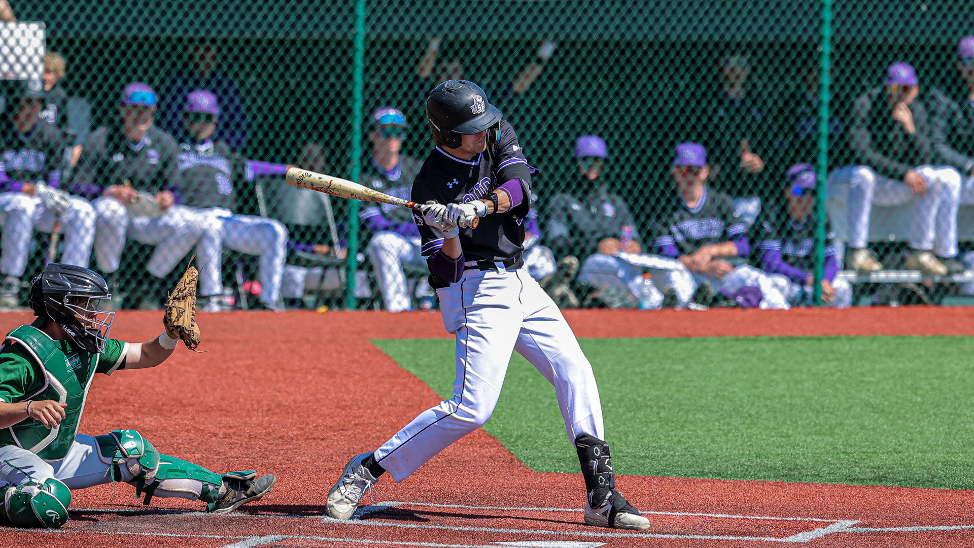 Drew Miller swings at a pitch