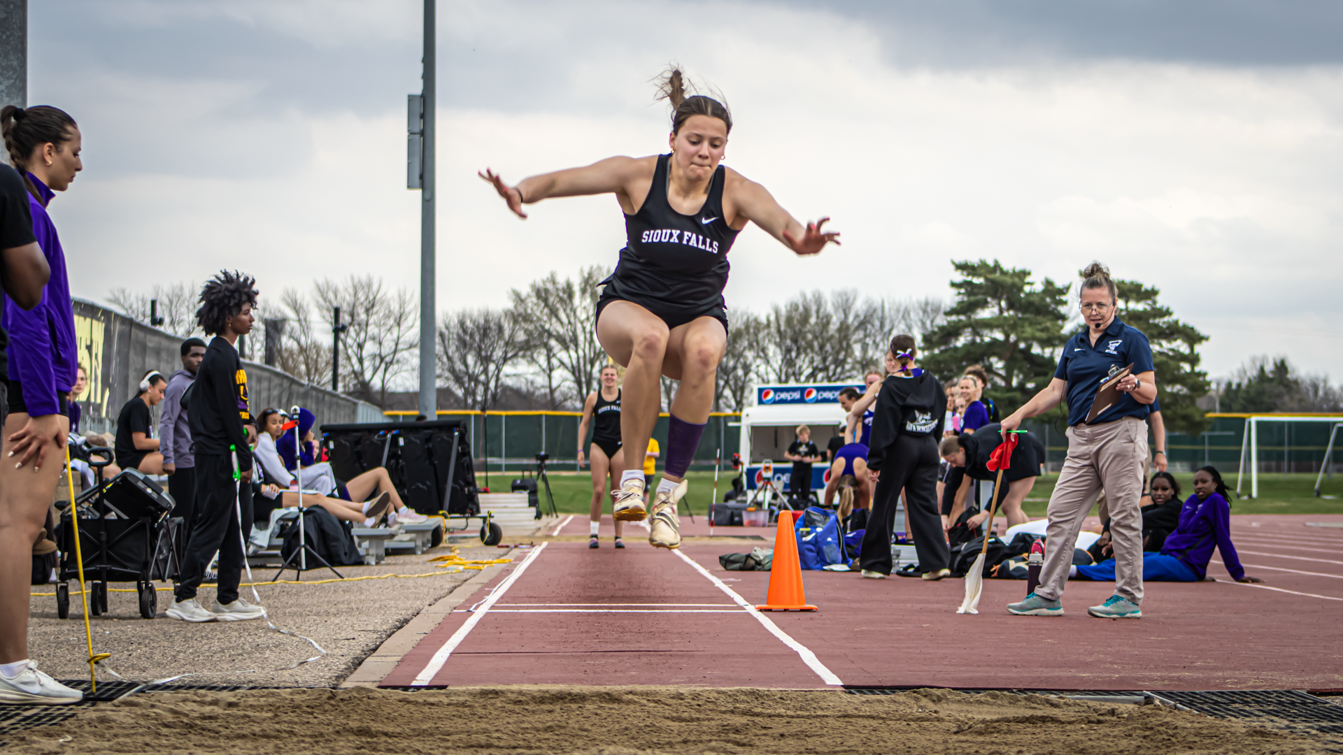 Cadence Nuttbrock flies through the air in her event