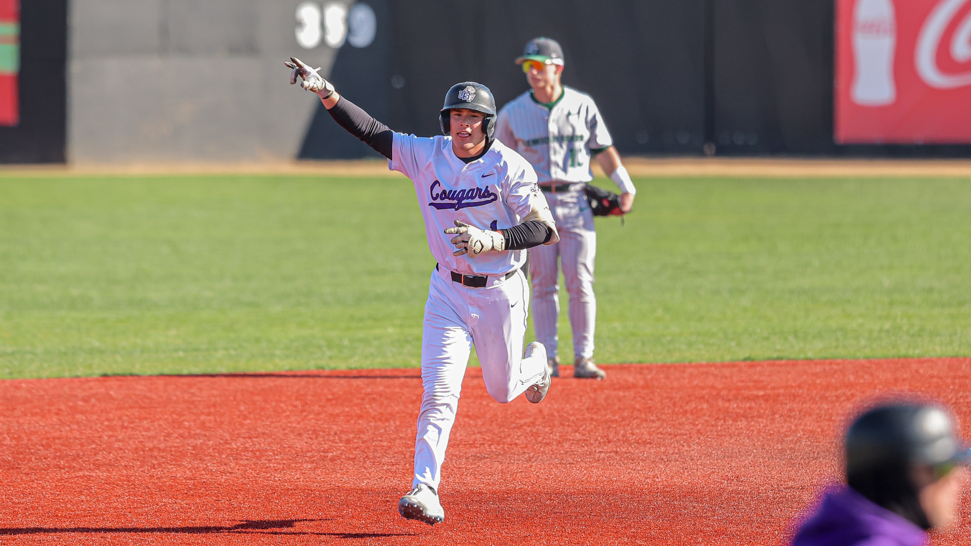 Cullen Verville points as he rounds the bases during a homerun