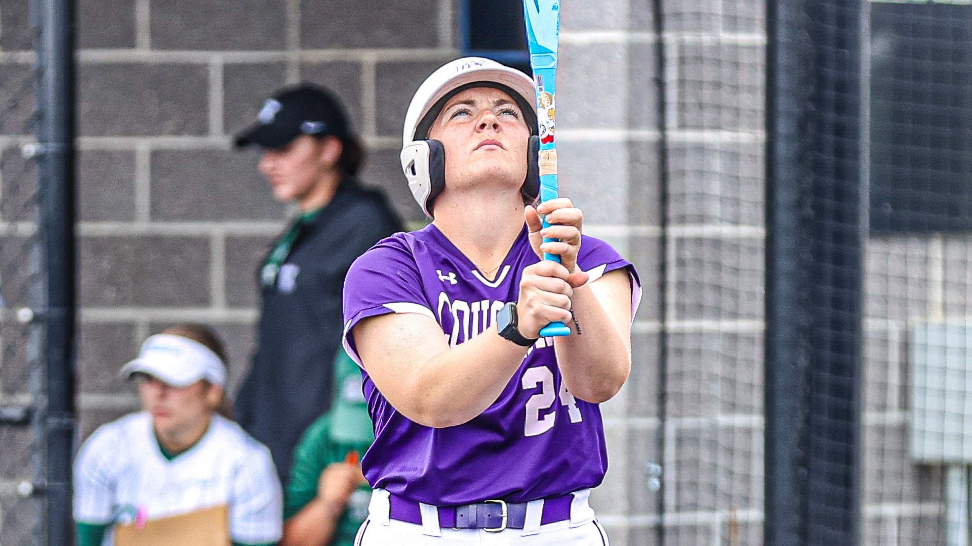 Kyra Knudtson looks at bat before at-bat