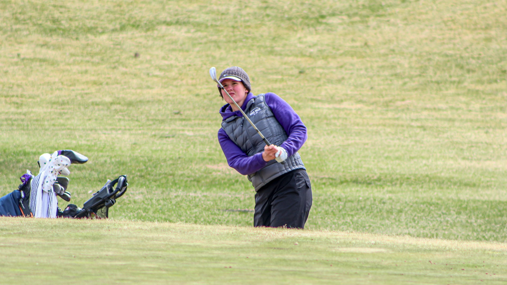 Gwen Latunski hits a pitch shot