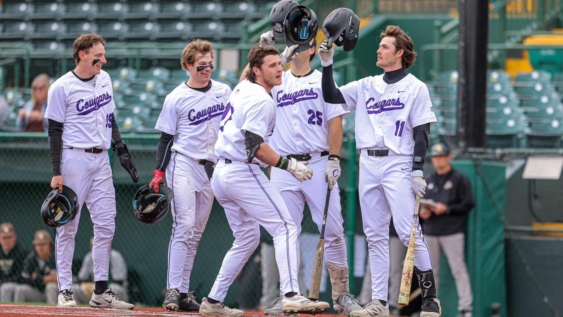 Mitch Iliff celebrates with teammates after home run