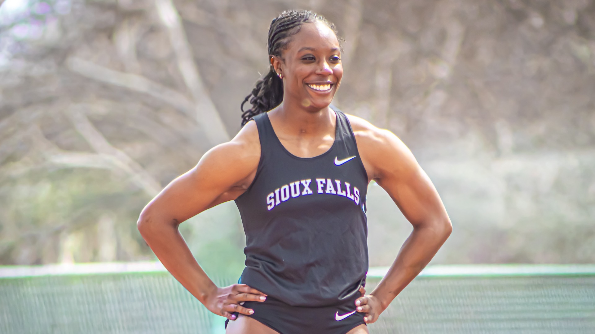 Tamia Horton smiles while preparing for the 100 meter dash at NSIC Outdoor track & field championships