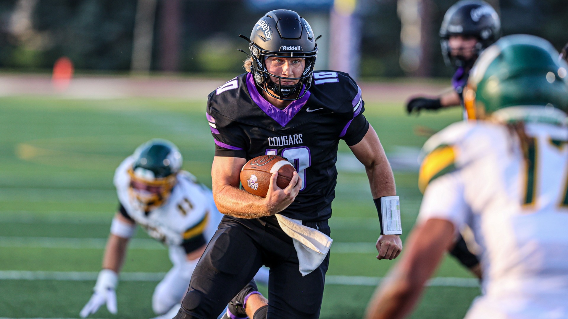 USF Quarterback Tate Schafer runs the ball against Black Hills State