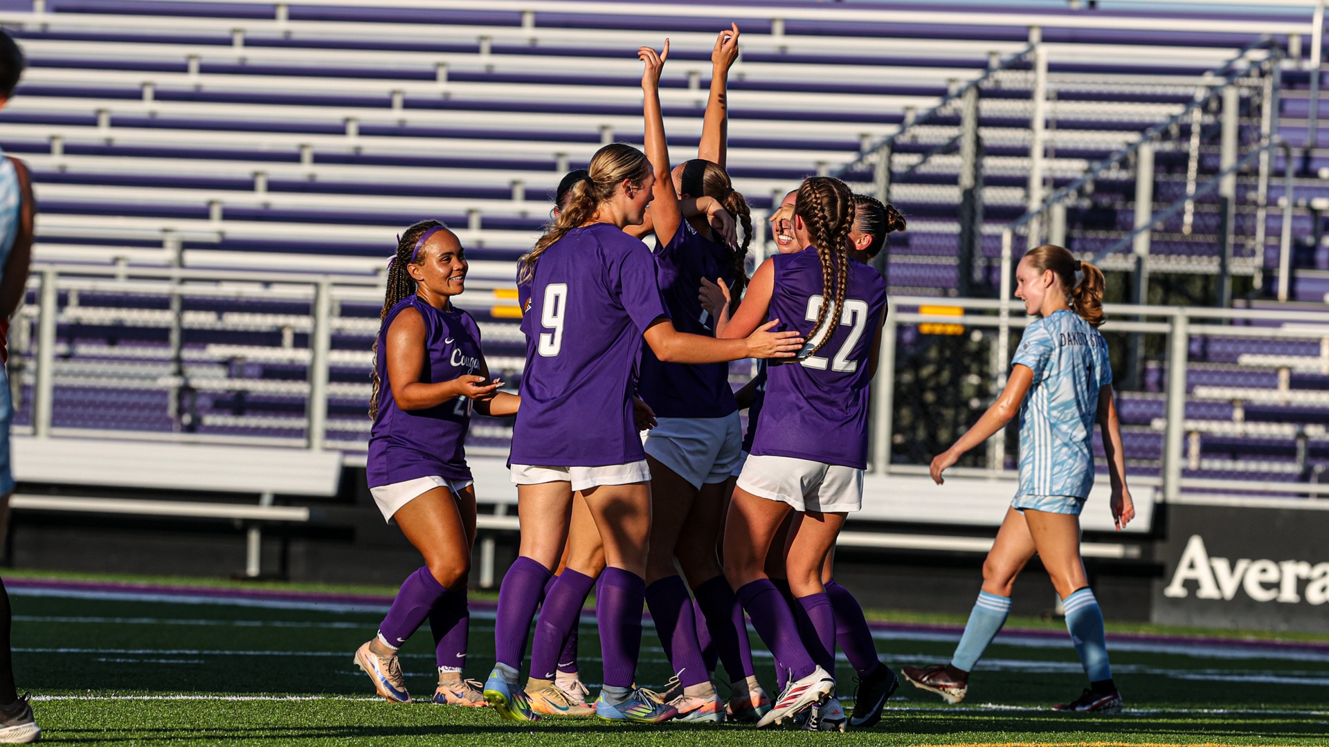 USF Soccer celebrates after a goal scored by Addison Van Zee
