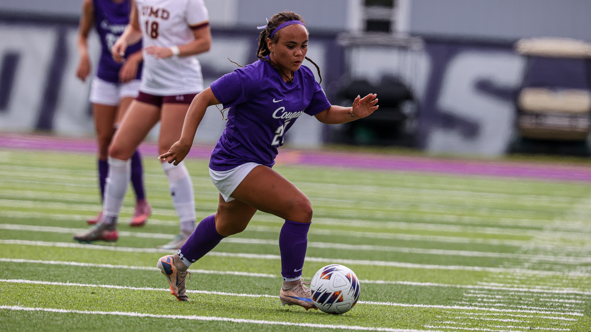 Chloe Wilson dribbles the soccer ball against Minnesota Duluth