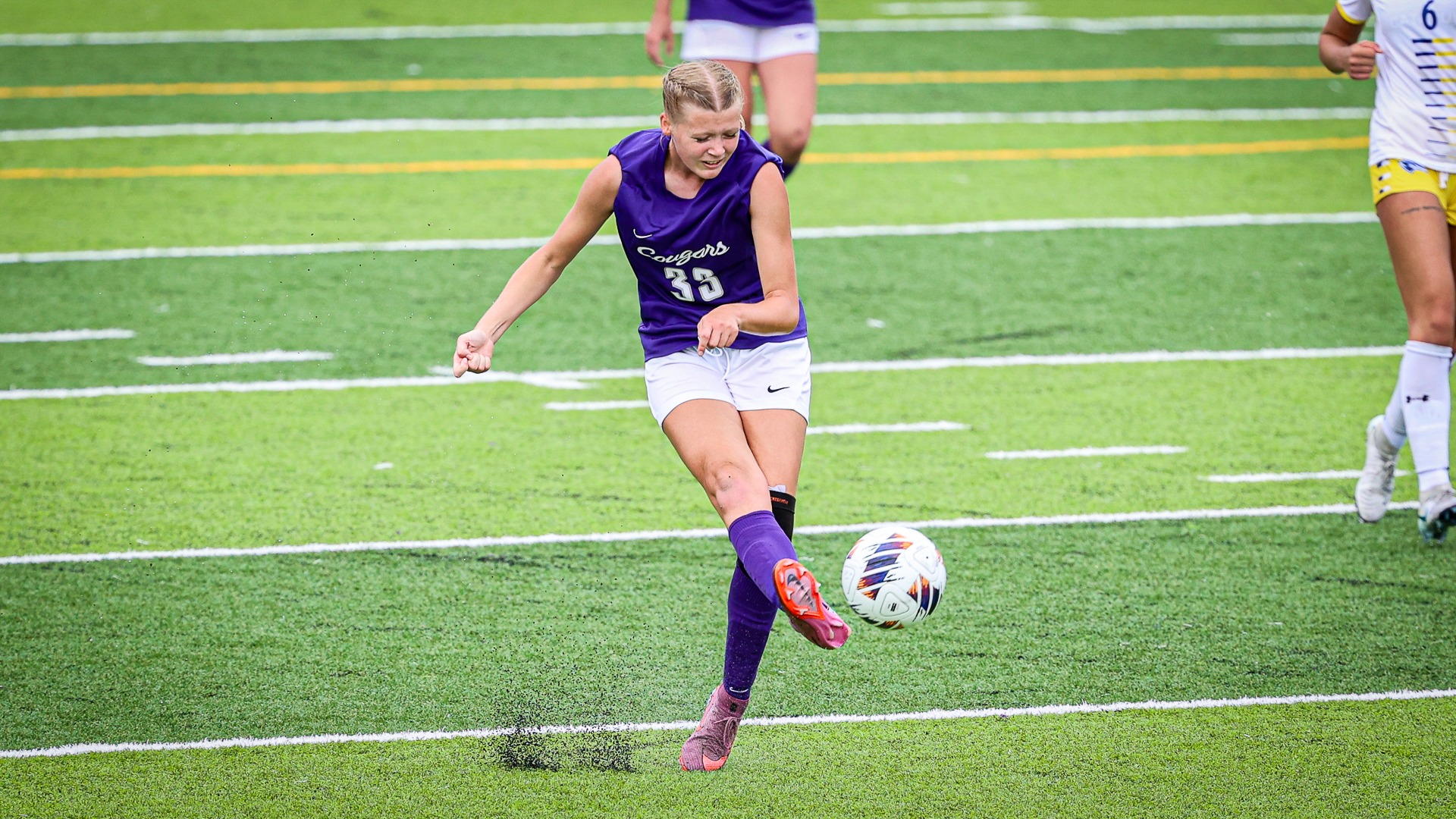 Abby Flanigan shots the ball against nebraska kearney