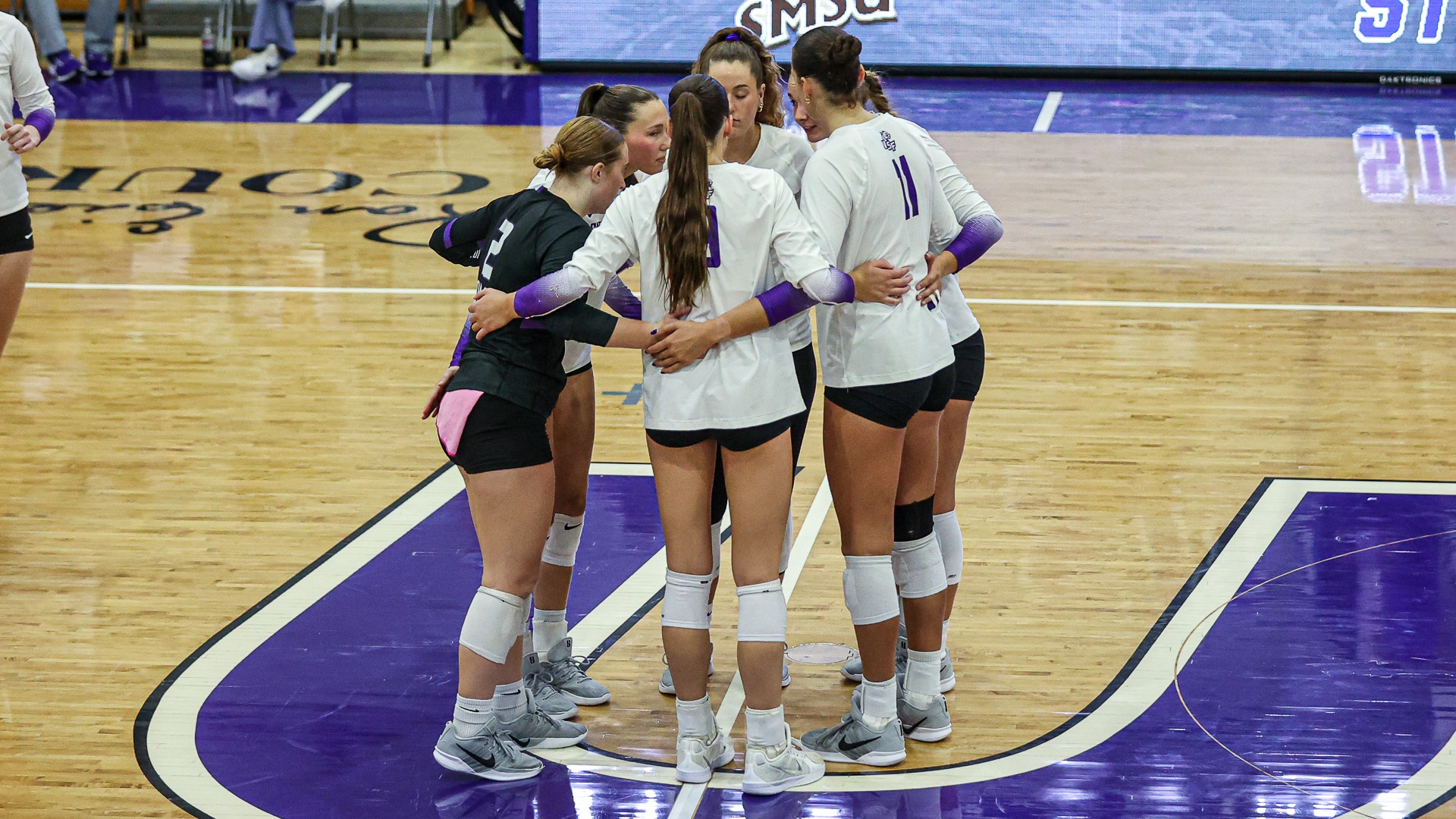 2026 USF Volleyball team huddles following loss against No. 11 SMSU