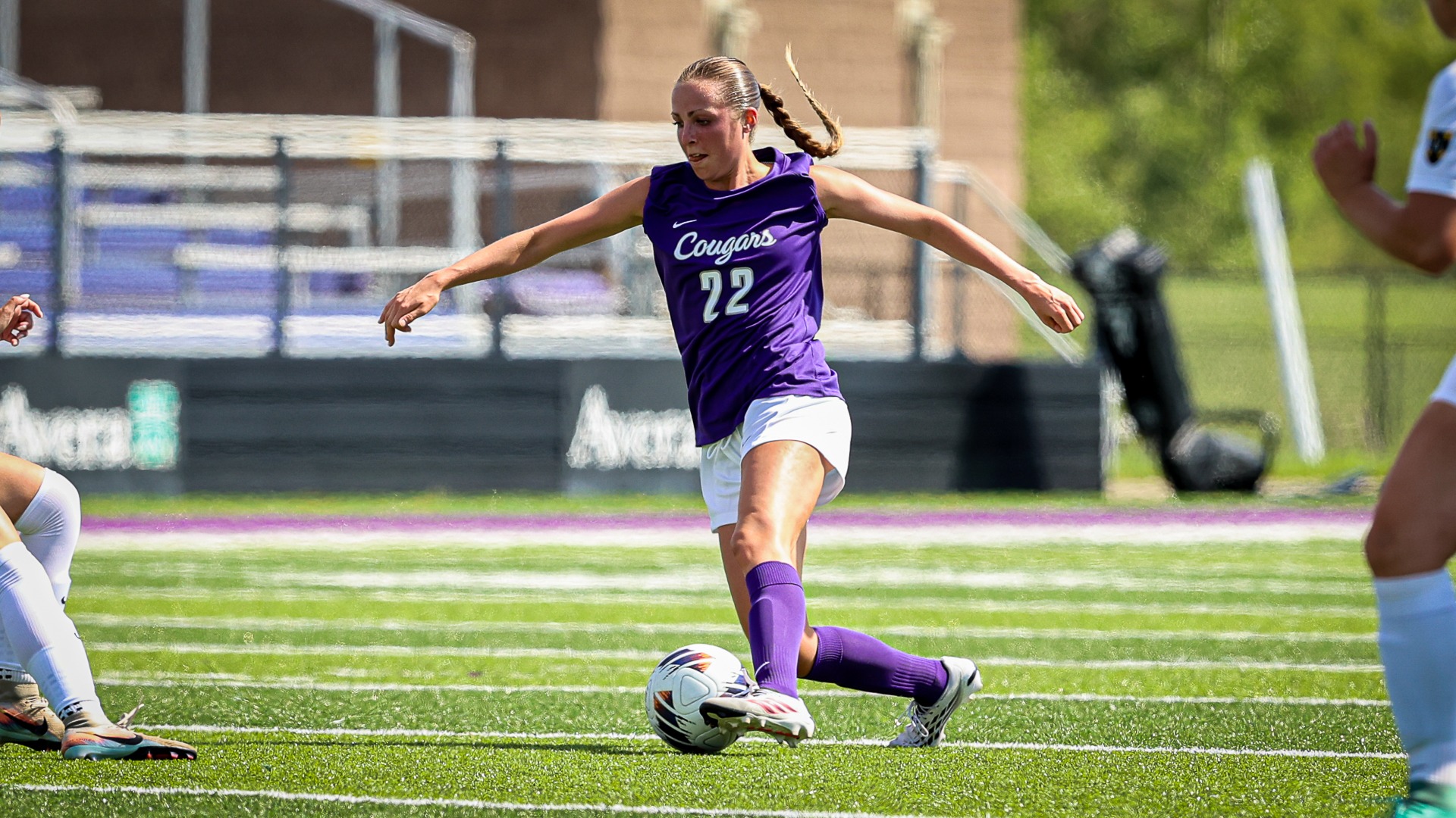 Lily Dahler dribbles the soccer ball against Gustavus Alophus