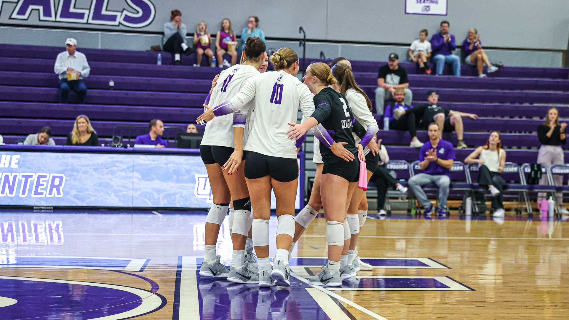 USF Volleyball huddles up after a point against Augustana