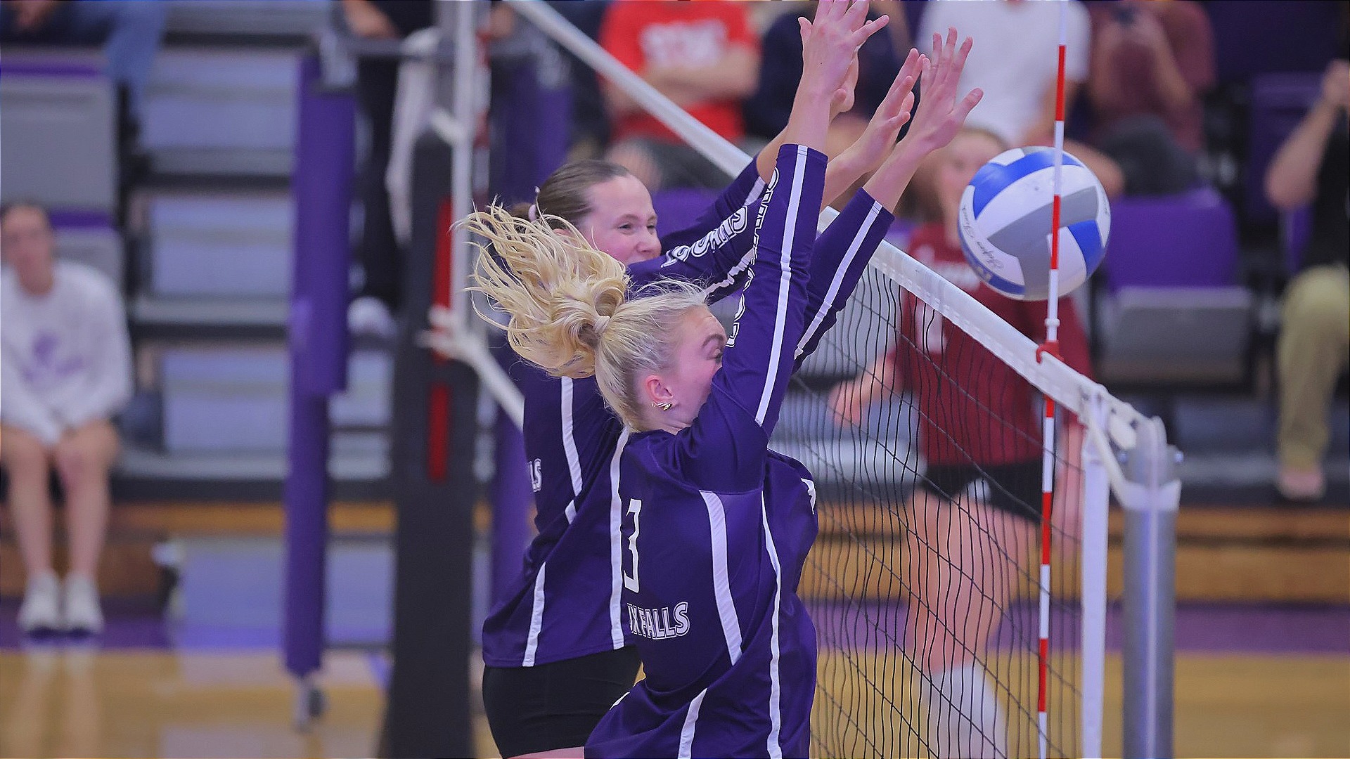 Ella Walker and Bre Van Den Top make a block against Chadron State