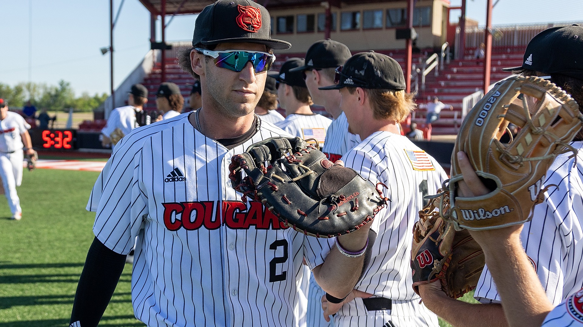 Ryan Niedzwiedz shake hands