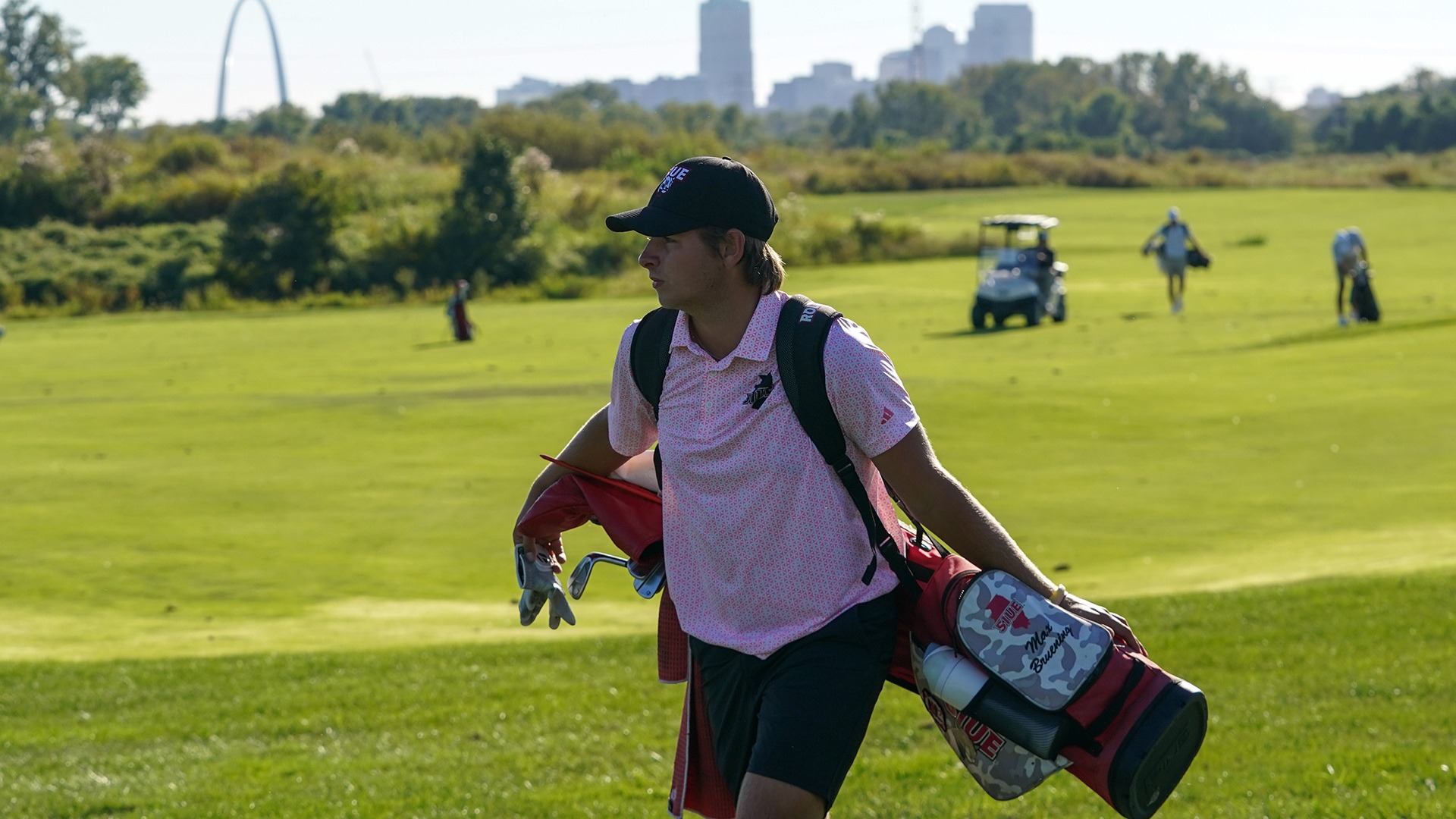 Max Brunening walks between shots at the Dolenc Invitational