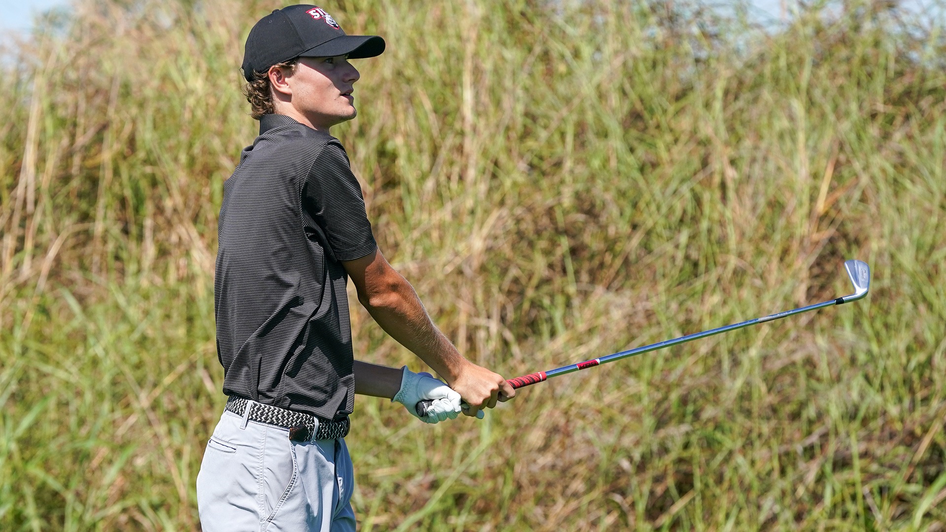 Trey Boecker watches a shot at the Dolenc Invitational