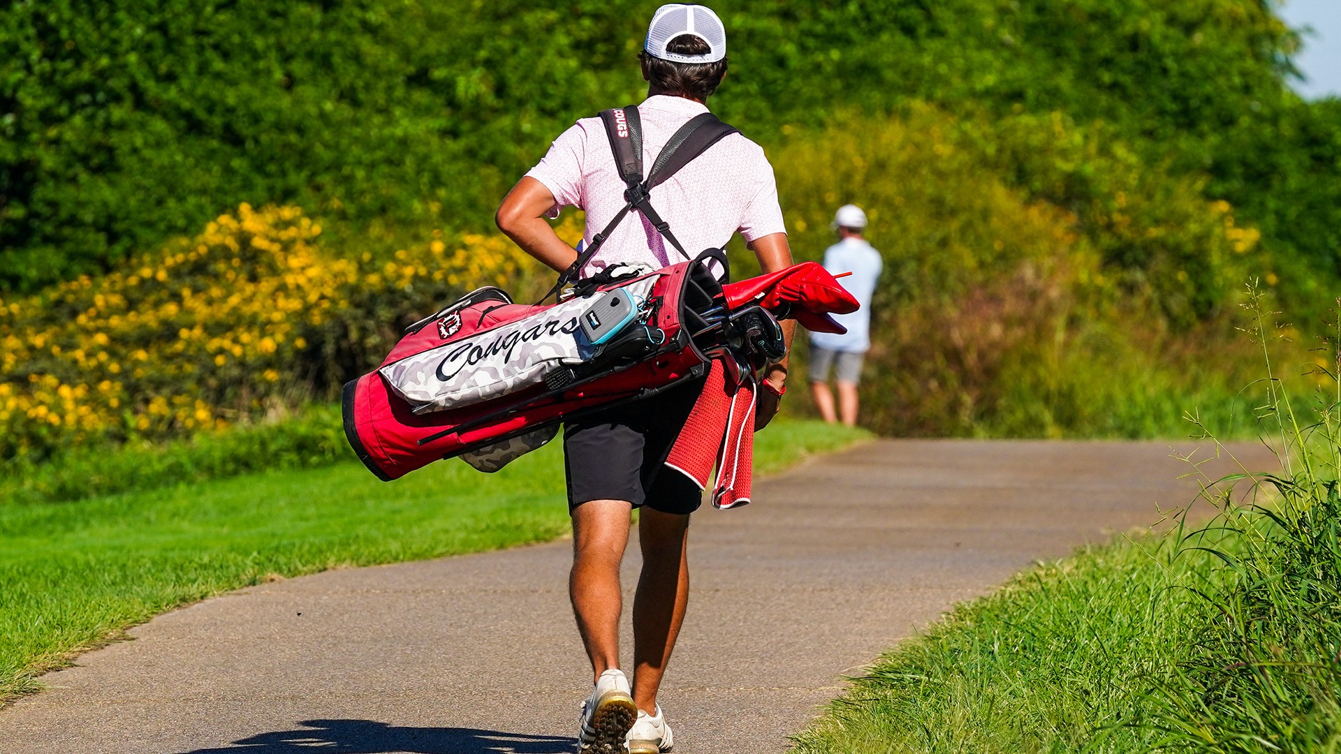 SIUE golfer with bag walking at Dolenc Invitational