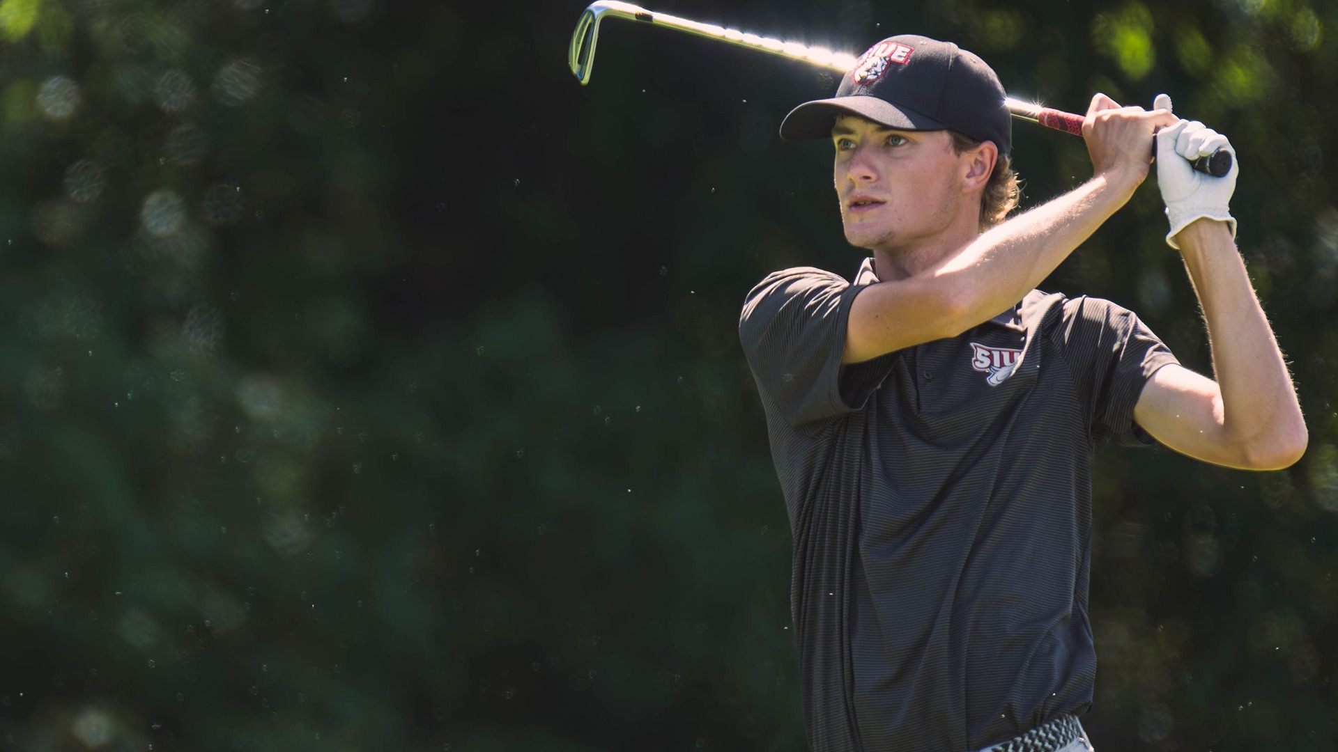 Trey Boecker finishes a shot at the Dolenc Invitational