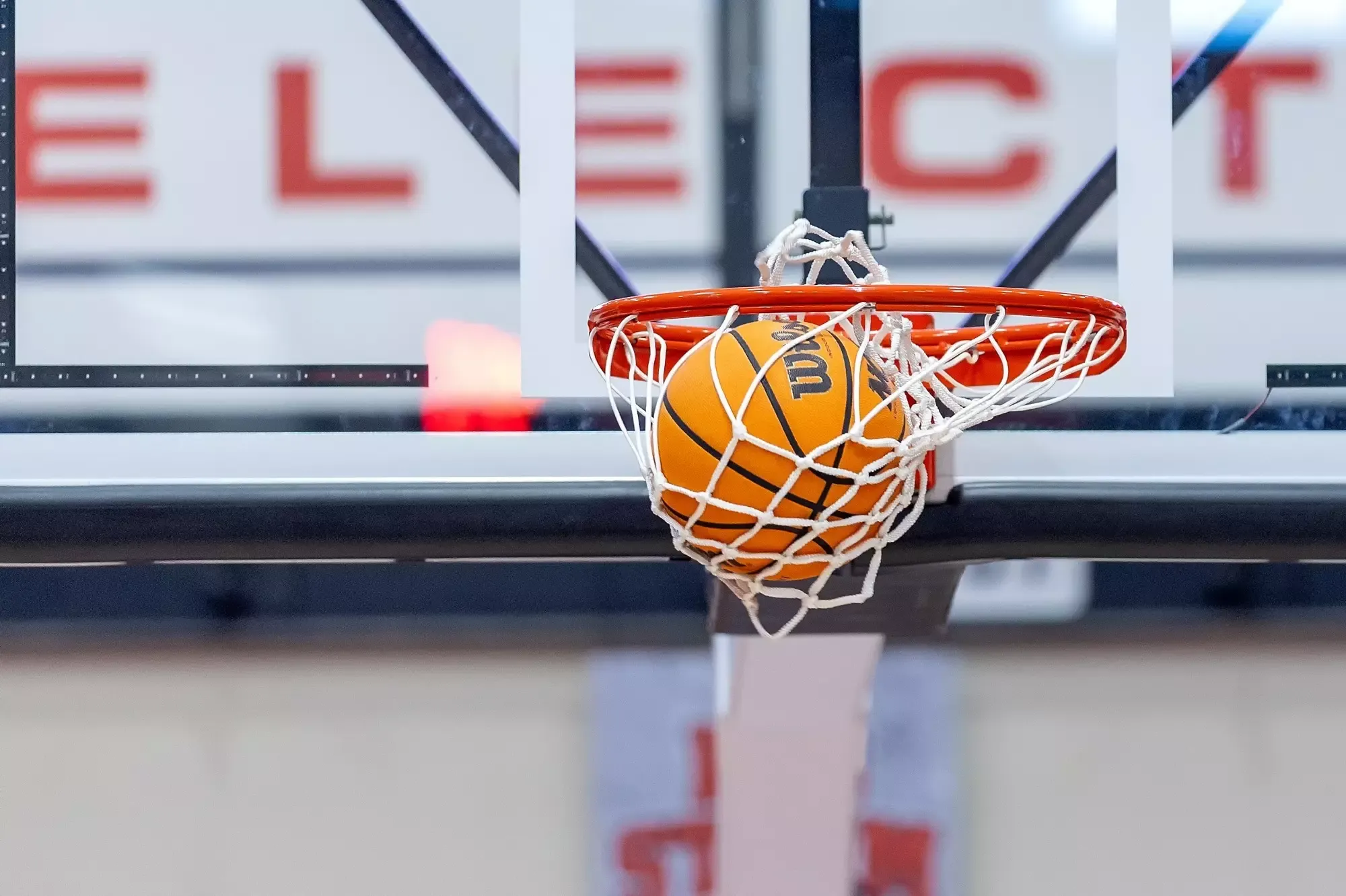 Basketball going through a hoop at First Community Arena
