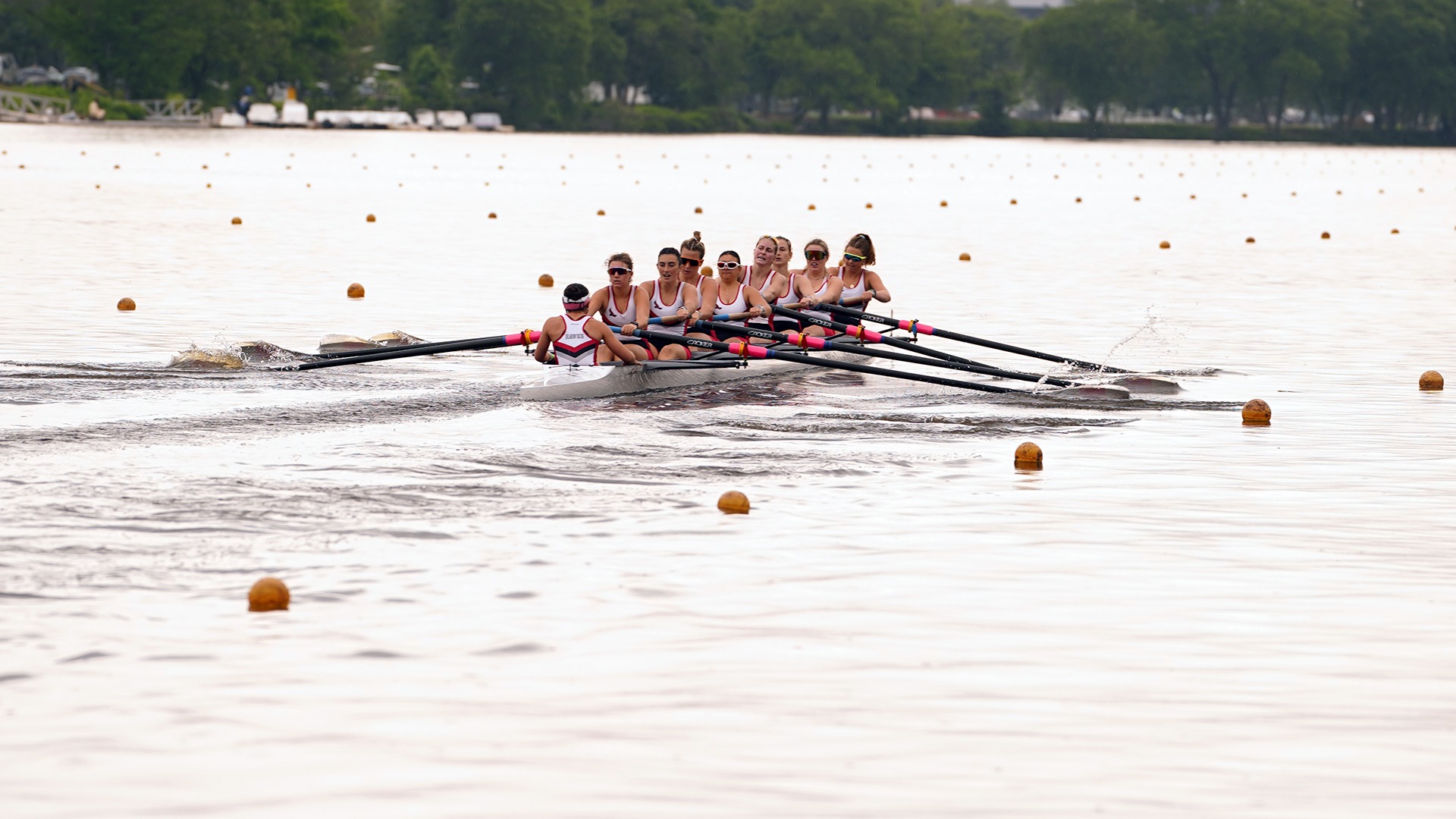 Women's rowing's 8 moves down the water.