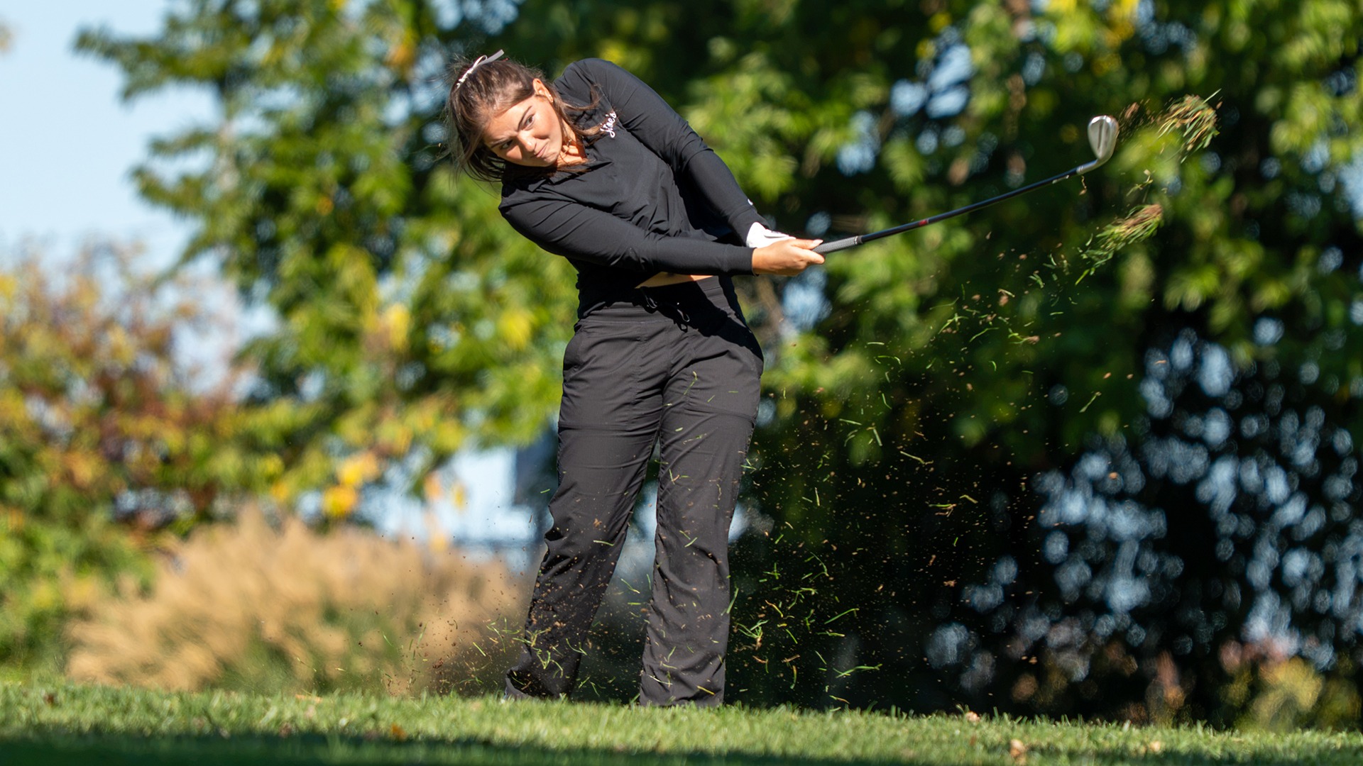 Olivia Kury hits an iron shot.