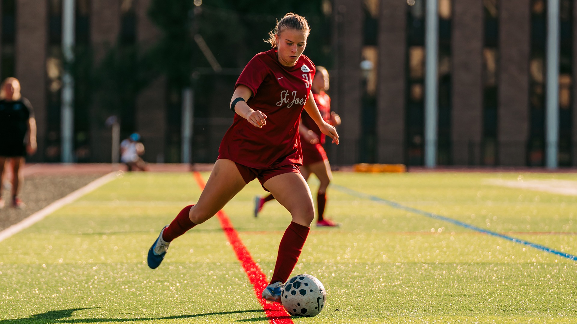Sarah Fisher strikes the ball.