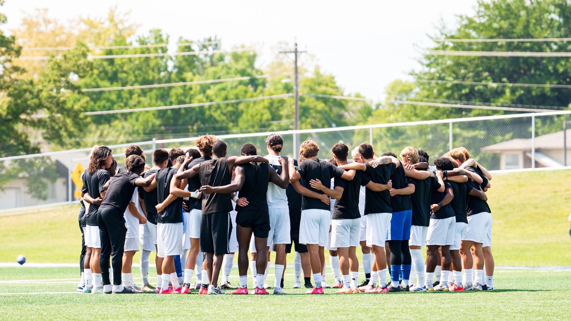 M Soccer Team Huddle