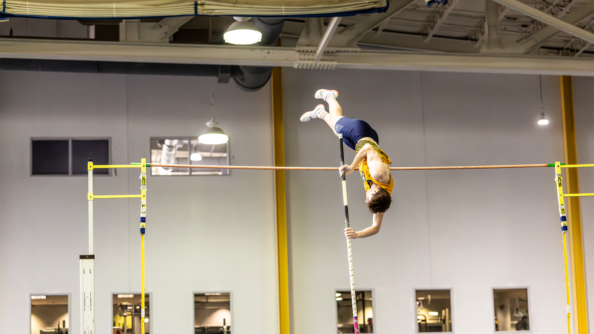 Zack Kralec pole vaulting over the bar at 2025 United East Indoor Track and Field Championships