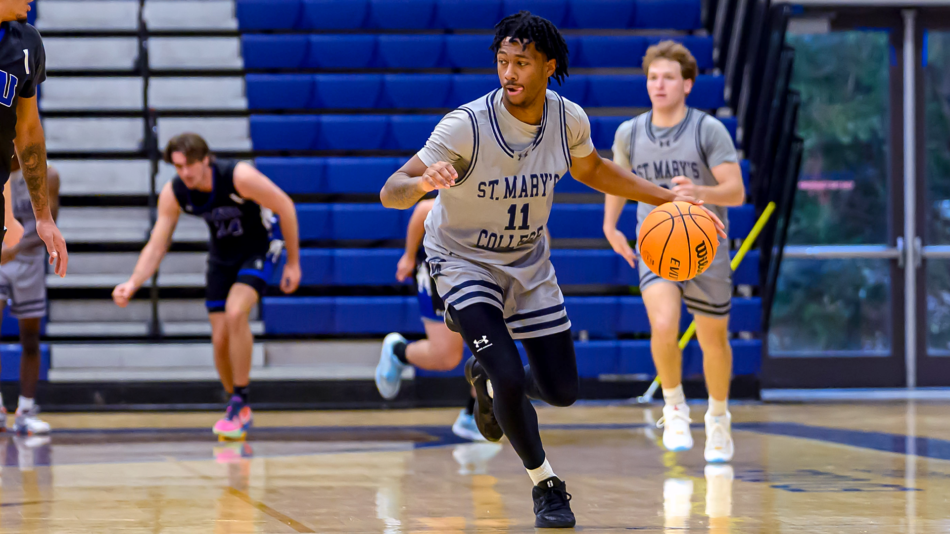 Khairi Hyde dribbles past Eastern Mennonite defender on Jan. 3, 2026