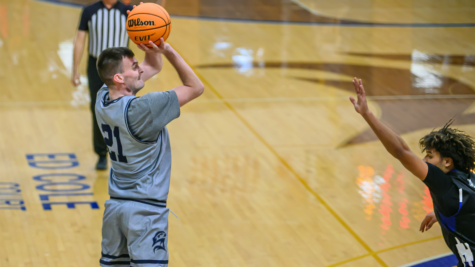Jake Koverman taking a shot over Eastern Mennonite defender on Jan. 3, 2026